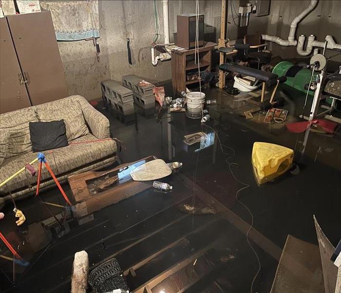 flooded basement with personal belongings