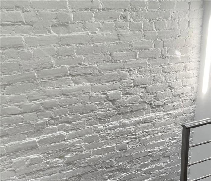 Freshly cleaned white brick wall