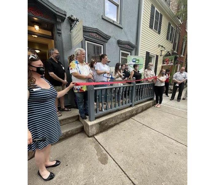 A group of people infront of a store