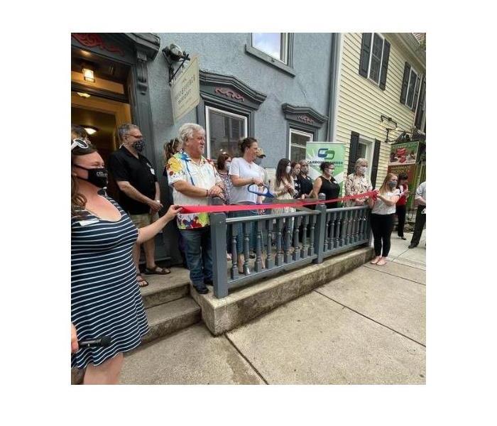 people standing infront of a store