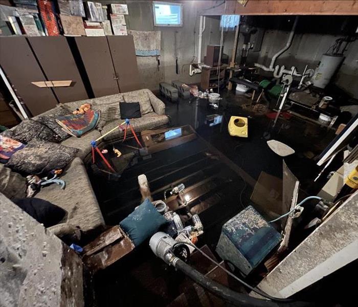 a basement with flooded water and mold 